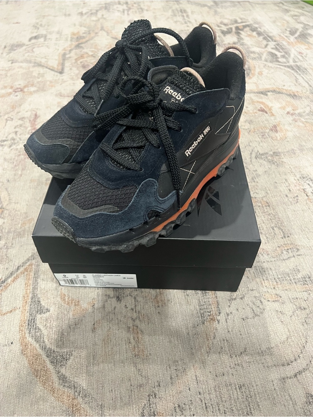 Reebok Women’s US 9 Cardi B Black Trail Sneakers with Orange Accent